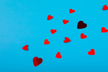 High angle view of red hearts isolated on blue background, copy space