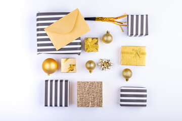 Overhead view of christmas gifts and decoration arranged over white background, copy space