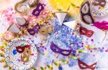 Fototapeta premium Party and carnival concept with masks, confetti and streamers