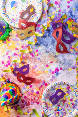 Fototapeta premium Party and carnival concept with masks, confetti and streamers
