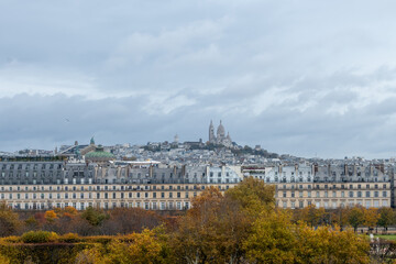 Panoramic view on Montmartre hill with church, streets, buildings, parks and museums in capital of France, central part of Paris, tourists destination, autumn days in Paris