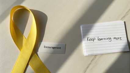 Yellow ribbon symbolizing support with notes of encouragement to inspire lifelong learning and personal growth