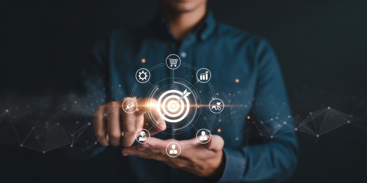 Digital Marketing Visionary: A man in a suit envisions the core of digital marketing, pointing at the center of the target, with interconnected icons around him. - Powered by Adobe