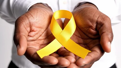 Man holding yellow ribbon isolated on white background