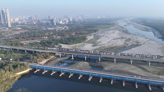 An Aerial Shot of Delhi Metro at Kalindi Kunj Bridge in Delhi, NCR, India
