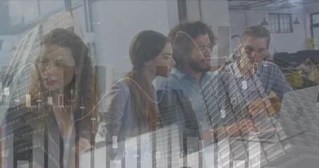 Animation of finance data over group of diverse businesspeople working with technology in office - Powered by Adobe