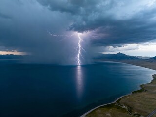 Aerial view of a lightning strike over a large lake during a stormy evening