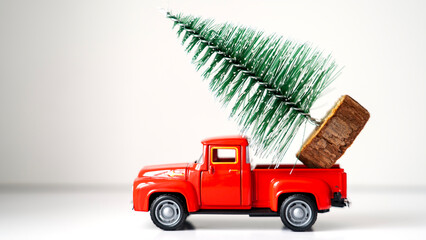 Toy car with a Christmas tree in the back
