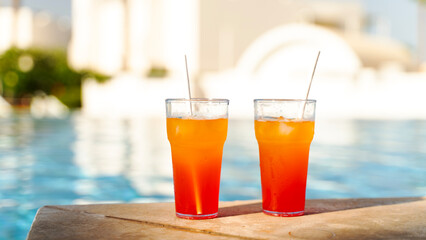 two cocktails in the pool on vacation on vacation