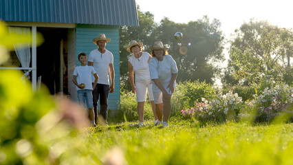 elderly people playing petanque on green grass