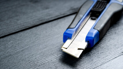 Construction cutter on black background