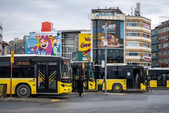 stanbul, Turkey - January 02, 2026: Yellow city buses parked at the Kadikoy bus terminal