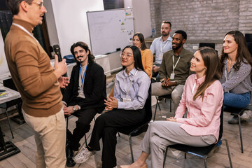 Businessman Leading Conference with Presentation