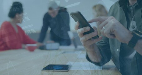 Animation of data processing over caucasian businessman using smartphone in office - Powered by Adobe