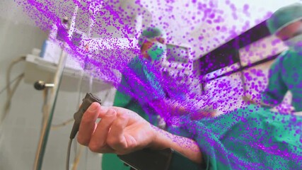 Animation of network of purple particles over diverse group of surgeons operating on patient - Powered by Adobe