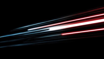 Streaks of red and blue light trails on a dark background