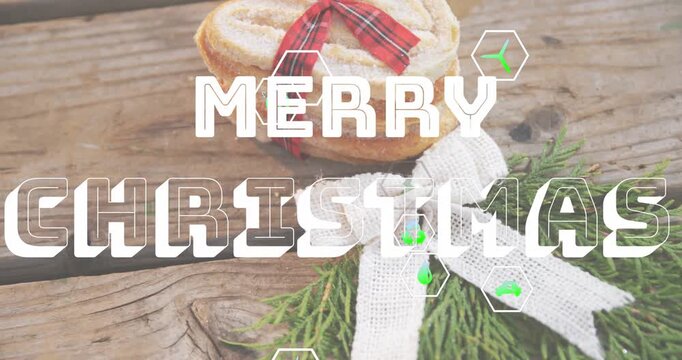 Animation of merry christmas 2023 text banner against close up of christmas dessert and herbs