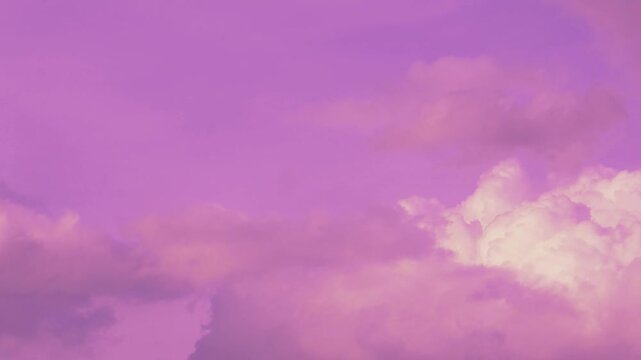 Time Lapse footage of dreamy surreal purple sky with spreading white clouds