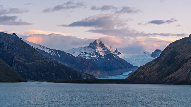 Strait of Magellan Sunset with Mountain and Glaciers View From Ship. Beautiful Colors Calm Waters Travel Remote Location
