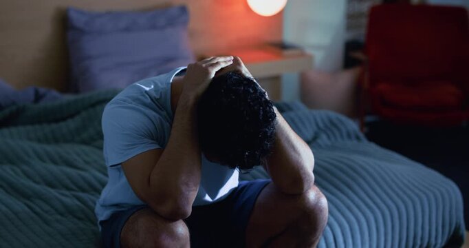 Stress, man and thinking in bedroom at night with anxiety, insomnia and memory of past trauma. Grief, male person and ptsd reflection with sleep disorder, emotional pressure and overthinking in home