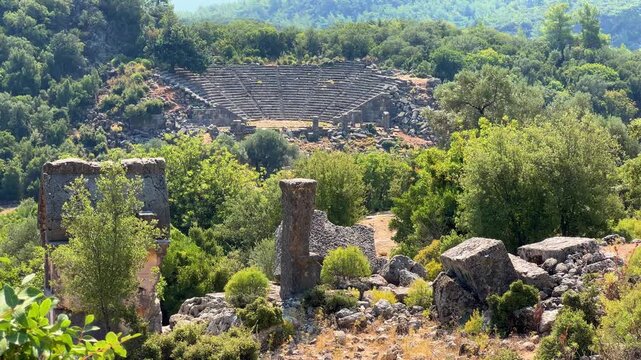 View of the ancient amphitheater in Pynara, Fethiye, Turkey. The Greek-style amphitheater is a structure from the ancient Lycian city of Pynara (Pynara). Lycian city. 4К