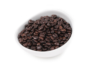 Fototapeta premium Espresso dark roast coffee beans in a white bowl, isolated on white background. Studio food photography.