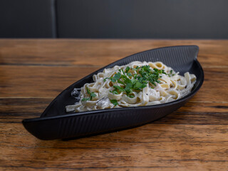 delicious traditional pasta on wooden restaurant table