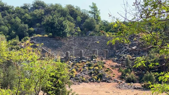 View of the ancient amphitheater in Pynara, Fethiye, Turkey. The Greek-style amphitheater is a structure from the ancient Lycian city of Pynara (Pynara). Lycian city. 4К