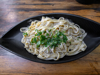 delicious traditional pasta on wooden restaurant table