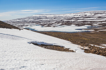 Rocks and snow on the Putorana Plateau. Taimyr. Russia