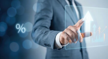 Asian male executive in a grey suit indoors interacting with a glowing digital growth chart and upward arrows, conceptualizing business success, profit increase, and financial technology.
