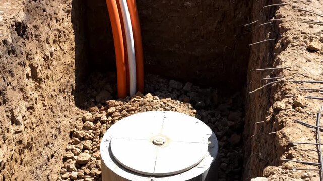 Underground Fiber Optic & Electrical Conduit Installation: Trench to Manhole