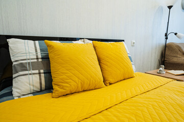 Vivid Bedroom Scene, Cheerful Room With Colorful Bedding, Stylish Bedroom Featuring Bright Mattress And Vibrant Accents, Lively Bedroom Setting With Coordinated Pillows And Warm Lighting