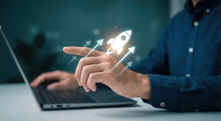Professional adult man in a blue shirt indoors at a desk pointing at a glowing digital rocket icon with arrows, symbolizing startup growth and business success in a moody office setting.