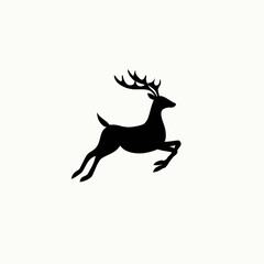 Fototapeta premium Black silhouette of a leaping deer with antlers on a plain white background
