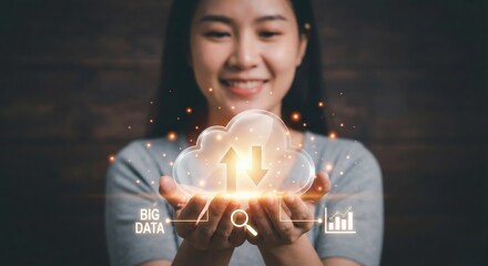 Smiling adult East Asian woman holding a glowing digital cloud for computing and data storage technology indoors, showcasing big data networking and connectivity.