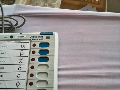 Bharat Electronics Limited ballot unit for elections and voting training, showing candidates, EVM buttons, control unit and VVPAT awareness during a mock poll demonstration for electoral education