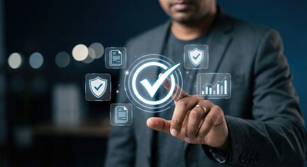 Professional adult South Asian man in a suit touching a glowing digital quality assurance checkmark interface in a modern office, concept of compliance and data management technology.