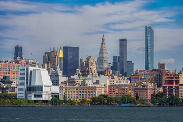 New York City skyline with Hudson Yards skyscrapers and passing cruise ship. Manhattan Midtown West cityscape from Hoboken River Park piers