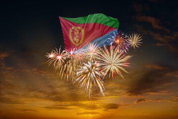 Flag of Eritrea and Holiday fireworks in sky
