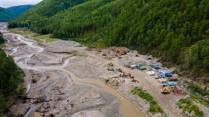 View from above. Mining of loose gold. A river destroyed by gold miners. A developed field in the taiga.