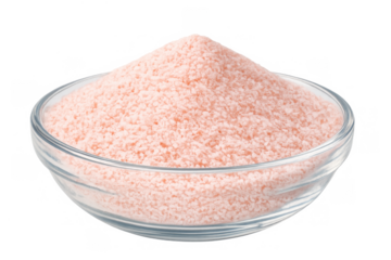 Himalayan pink salt in a glass bowl, commonly used as a seasoning and healthy mineral food ingredient