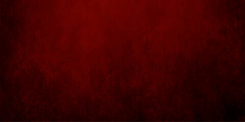 Fototapeta premium A dark red grunge wall texture with a vintage aged paper pattern and rough textured material creates a grungy retro backdrop design for a blank Christmas canvas wallpaper
