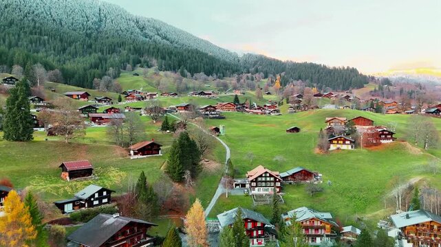 Scenic view of Grindelwald, Switzerland with majestic alpine mountains, lush green meadows and traditional village homes, peaceful countryside atmosphere, travel and nature concept, high quality rende