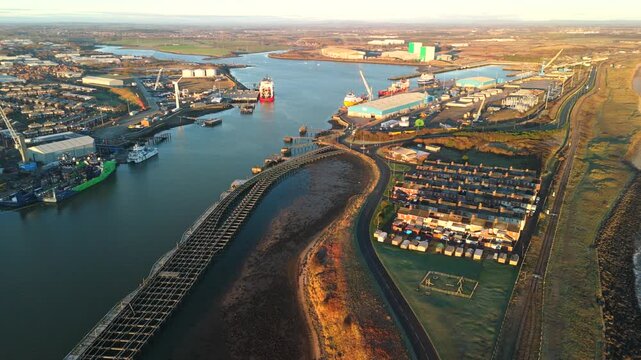 Blyth Northumberland UK: 31st Dec 2025: Drone aerial view of Port of Blyth with docks and industrial buildings along the water in the harbour