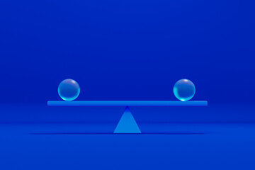 Balance of two spheres on a blue seesaw in simple design