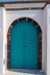 Fototapeta premium White washed wall and door in Oia, Santorini, Greece