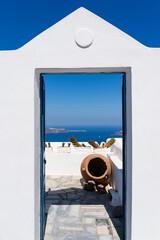 View through a doorway in Imerovigli to the Agean Sea, Santorini, Greece