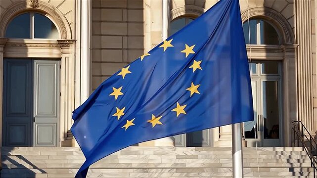 Drapeau de l&rsquo;Union europ&eacute;enne flottant devant un b&acirc;timent officiel