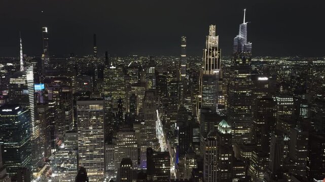 New York City skyline illuminated skyscrapers at night wide 
